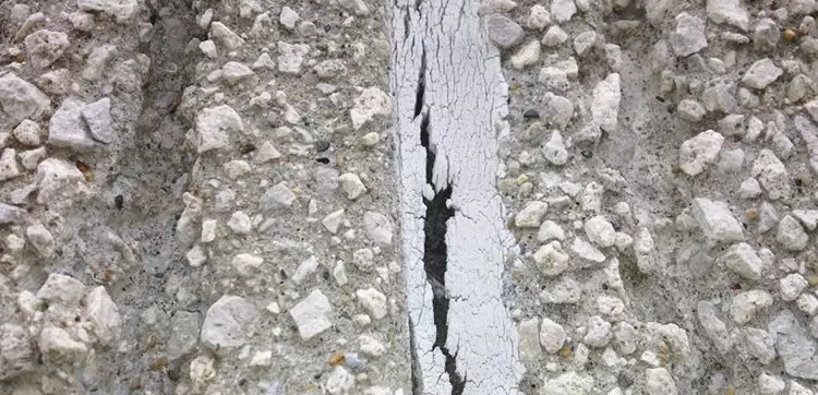 Concrete joint showing sealant failure caused by excessive joint movement