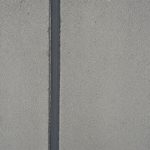 Expansion joint sealer applied to a concrete pavement joint