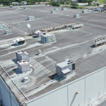 Aerial view of a flat industrial roof with HVAC cooling units, suited for data centre roof coating application