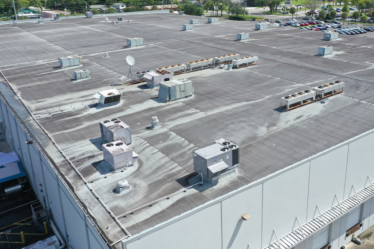 Aerial view of a flat industrial roof with HVAC cooling units, suited for data centre roof coating application